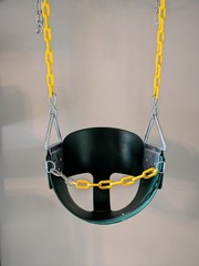 Green Full Bucket Toddler Swing Seat with Yellow Coated Chains.
