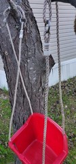 Red Plastic Toddler Swing With Rope